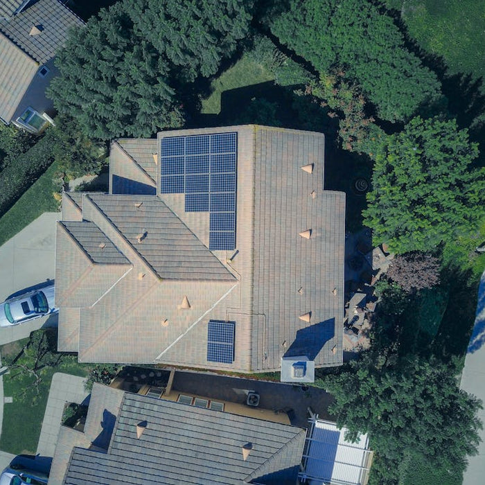 aerial view of house with solar panels on roof